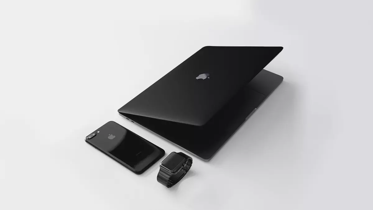 A black laptop, a black smartphone, and a black smartwatch on a white background.