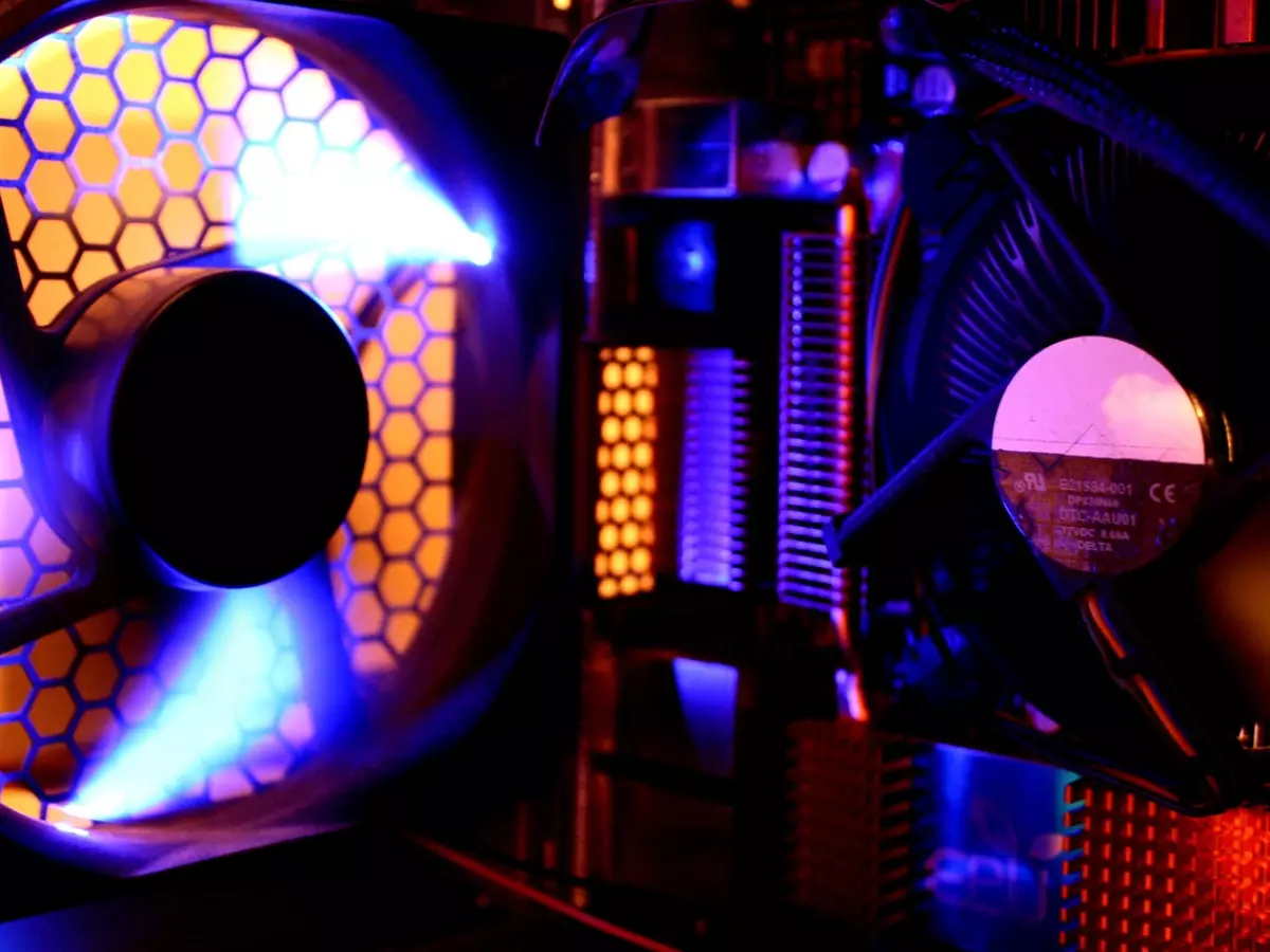 A close-up of a computer's cooling fan with colorful LEDs.