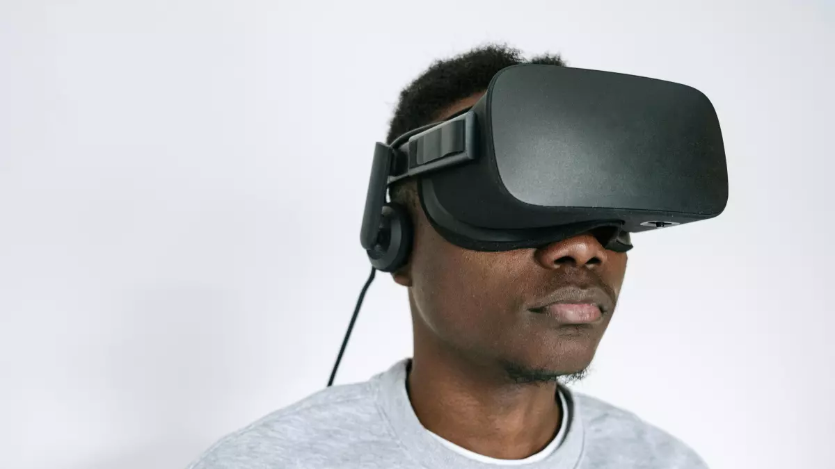 A man wearing VR goggles looking to the right