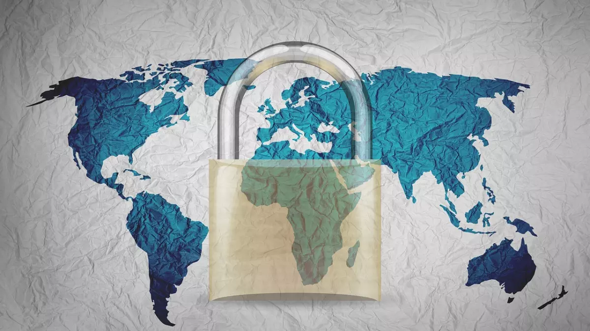 A padlock encloses a world map, highlighting the global significance of cybersecurity.