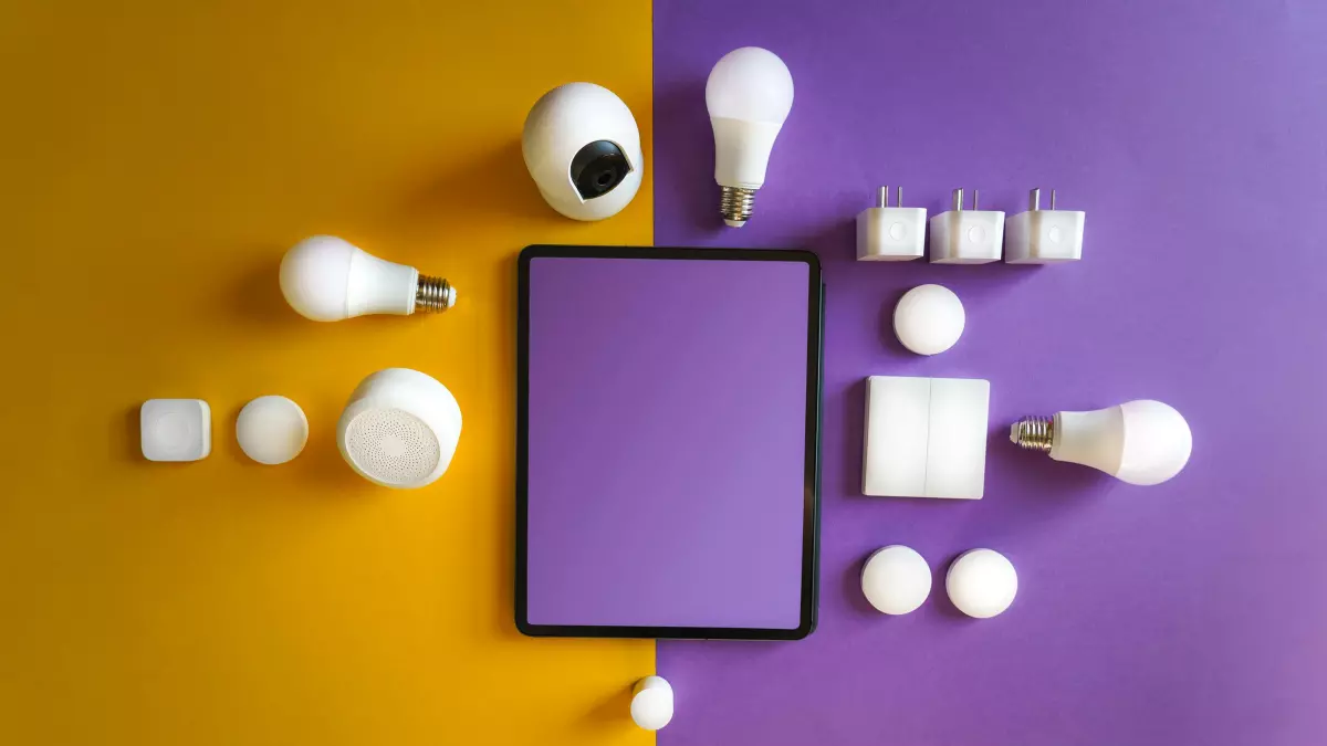 A flat lay of smart home devices on a purple and yellow background.